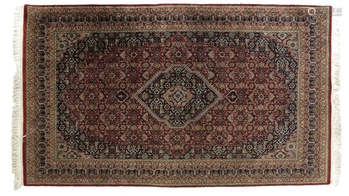 Oriental hand-knotted carpet