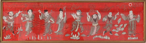Old textile in frame with 8 figures