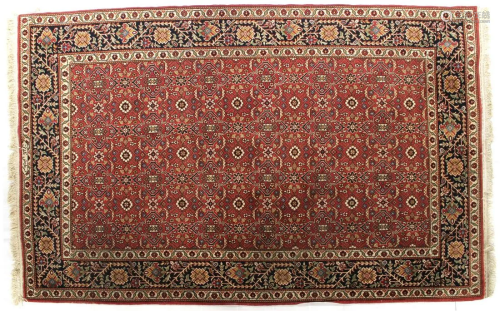 Oriental hand-knotted carpet