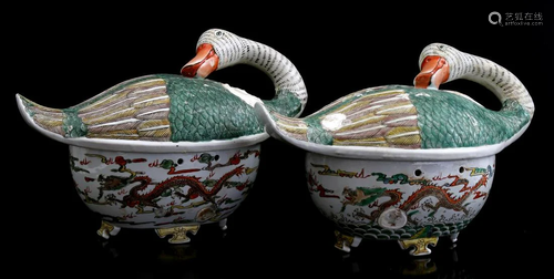 2 porcelain covered dishes in the shape of a goose