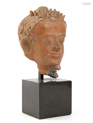 Ceramic head on natural stone base, possibly