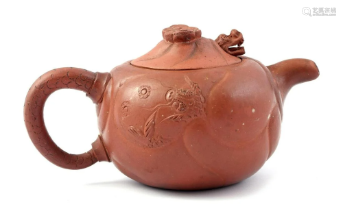 Yixing teapot with dragon relief decor and movable