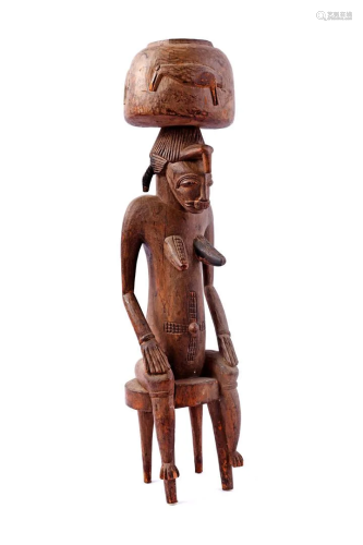 African ceremonial wooden statue of a woman with a