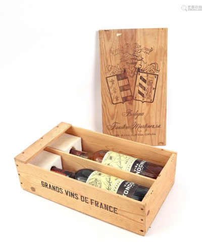 Bottle of red and white wine in wooden box