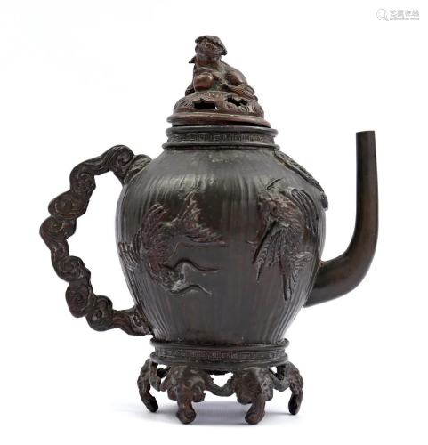 Bronze Asian teapot with richly carved decoration