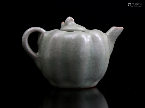 Glazed earthenware teapot in the shape of a pumpkin