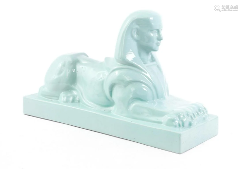 Unmarked, earthenware sculpture of a reclining sphinx
