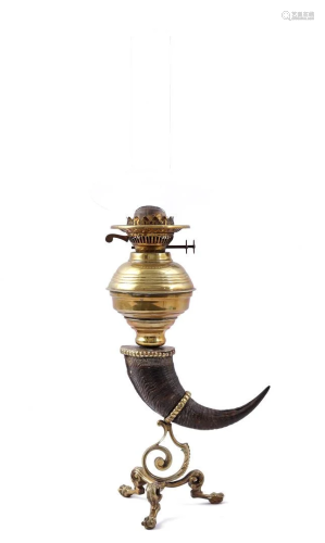 Brass table oil lamp with horn and standing on claw