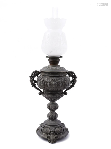Metal richly worked table oil lamp with polished