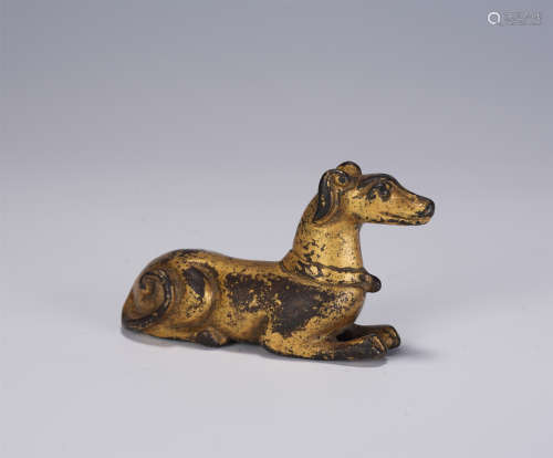 A CHINESE GILT BRONZE PAPERWEIGHT