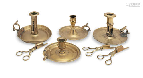 Four 18th/19th century brass chambersticks, English