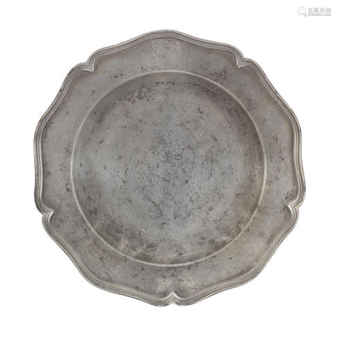 A George III pewter five lobed wavy edged armorial plate, ci...