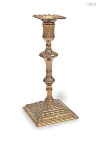 A good mid-18th century brass alloy socket candlestick, Engl...