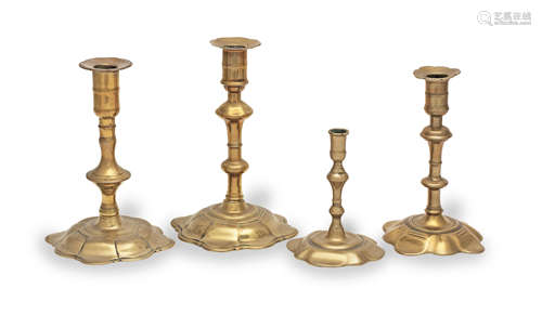 Three George II/George III brass alloy socket candlesticks, ...