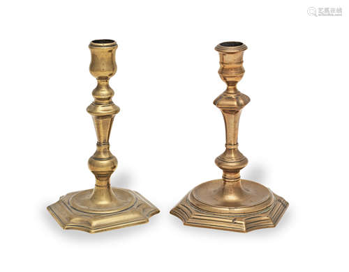 Two brass alloy socket candlesticks, circa 1725-40