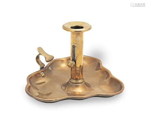 An unusual and patented Victorian sheet brass chamberstick, ...