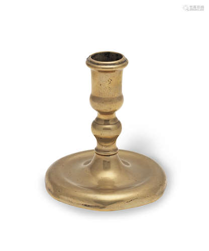 A rare early 18th century brass dwarf socket candlestick, ci...