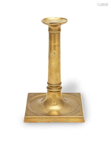 A late George III brass socket candlestick, circa 1800 Stamp...