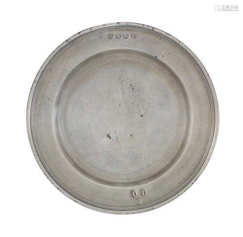 An unusual Queen Anne pewter single reed plate, circa 1710