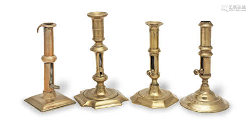 Four 18th century brass ejector candlesticks, English