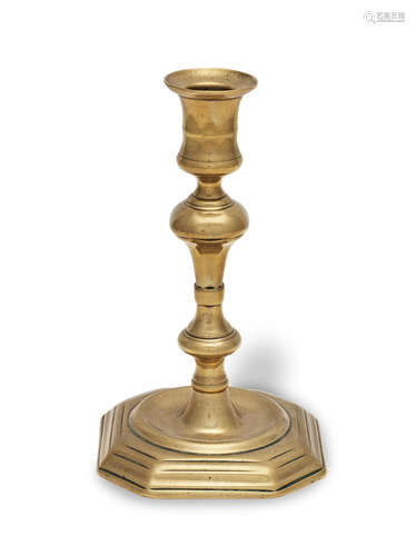 A George I brass socket candlestick, circa 1720 With the own...