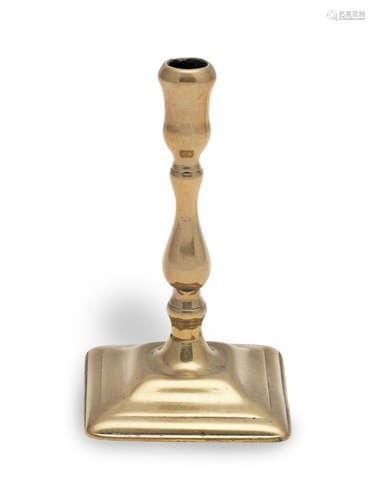 A George II brass taperstick, circa 1730-50