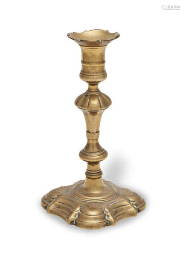 A George II brass socket candlestick, circa 1740