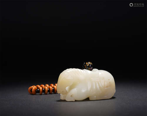 A CHINESE  WHITE JADE CROUCHING HORSE