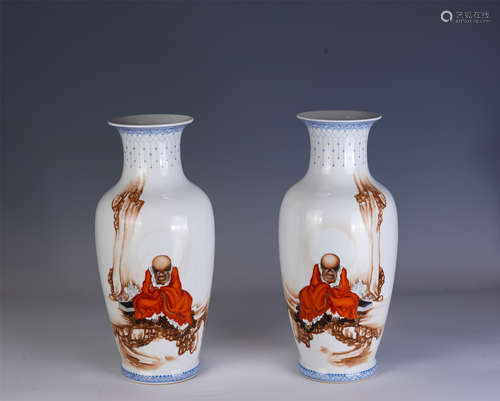 A PAIR OF CHINESE FAMILLE ROSE LUOHAN PORCELAIN VASES