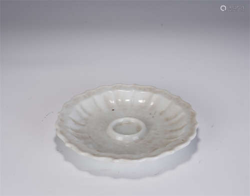 A CHINESE WHITE GLAZED PORCELAIN CANDLESTICK