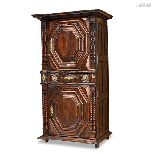 A BAROQUE STYLE BRASS MOUNTED OAK ARMOIRE 19th century