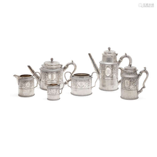 A VICTORIAN SILVER SIX-PIECE REPOUSSÉ COFFEE AND TEA SERVICE...