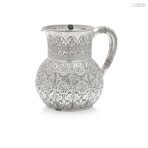 AN AMERICAN STERLING SILVER REPOUSSÉ WATER PITCHER by Tiffan...