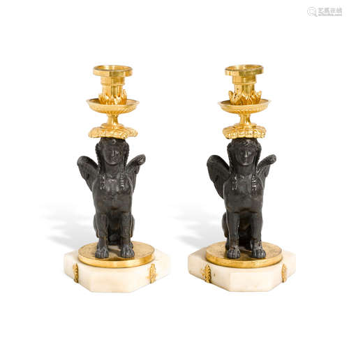 A PAIR OF NEOCLASSICAL STYLE GILT AND PATINATED BRONZE FIGUR...