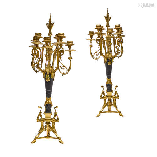 A PAIR OF EGYPTIAN REVIVAL BLACK PATINATED AND GILT BRONZE S...