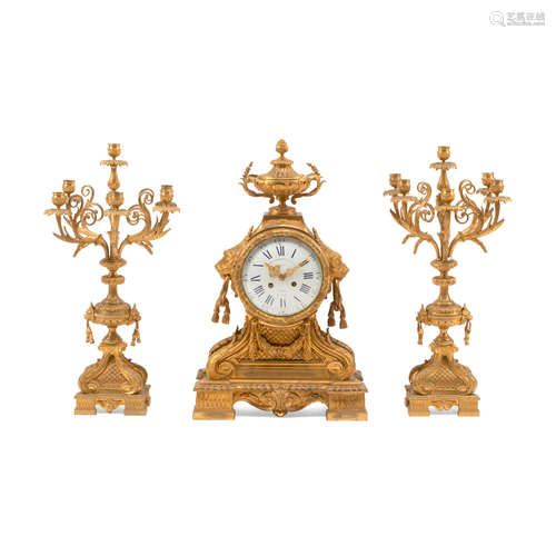 A NEOCLASSICAL STYLE GILT BRONZE THREE-PIECE CLOCK GARNITURE