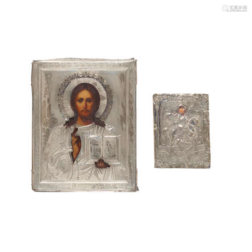 TWO SILVER COVERED POLYCHROMED WOOD ICONS Russian and Greek,...