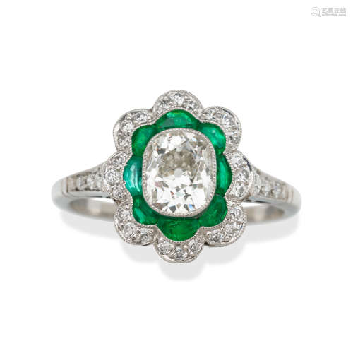 A DIAMOND AND EMERALD RING