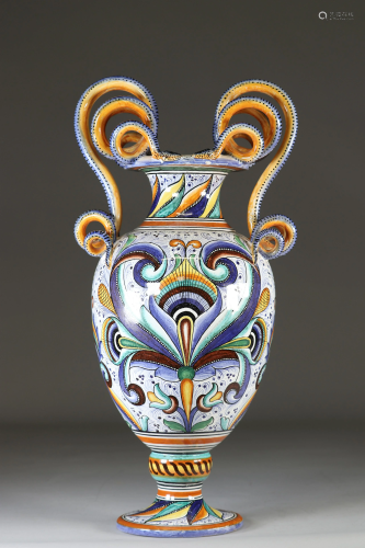 Large vase on pedestal with handles formed of