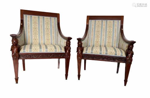 Pair of richly carved mahogany armchairs, armrests