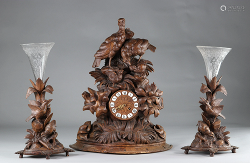 Black forest clock and its two Bohemian crystal vases.