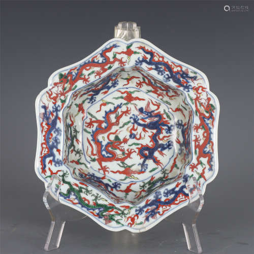 A CHINESE BLUE AND WHITE WUCAI PORCELAIN HEXAGONAL BRUSH WAS...