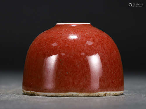 A CHINESE RED GLAZED PORCELAIN WATER POT