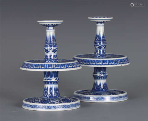 A PAIR OF CHINESE BLUE AND WHITE PORCELAIN CANDLESTICKS