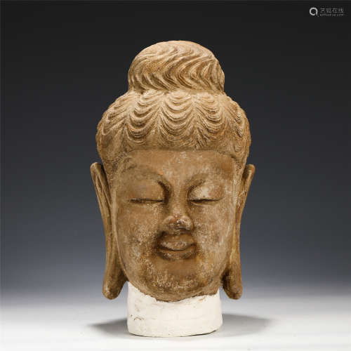 A CHINESE PORCELAIN BUDDHA HEAD
