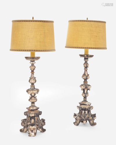A pair of large Italian giltwood alter candle lamps