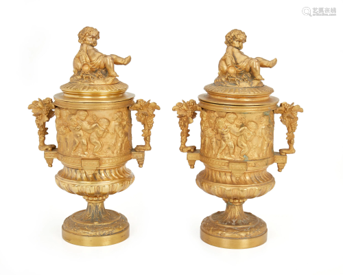A pair of Renaissance Revival gilt-bronze urns