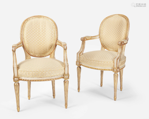 A pair of Louis XVI-style carved giltwood fauteuils