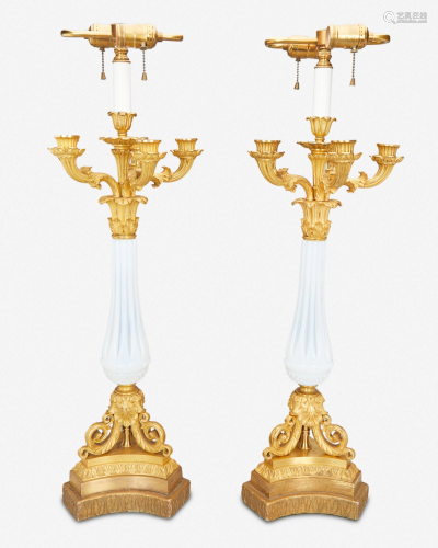 A pair of French gilt-bronze and opaline glass candle