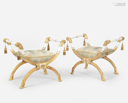 A pair of French-style carved giltwood curule seats